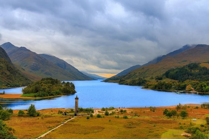 A lone stone column on the flat ground at the head of a long loch between hills